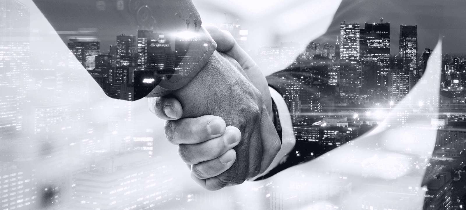 Business handshake with city skyline